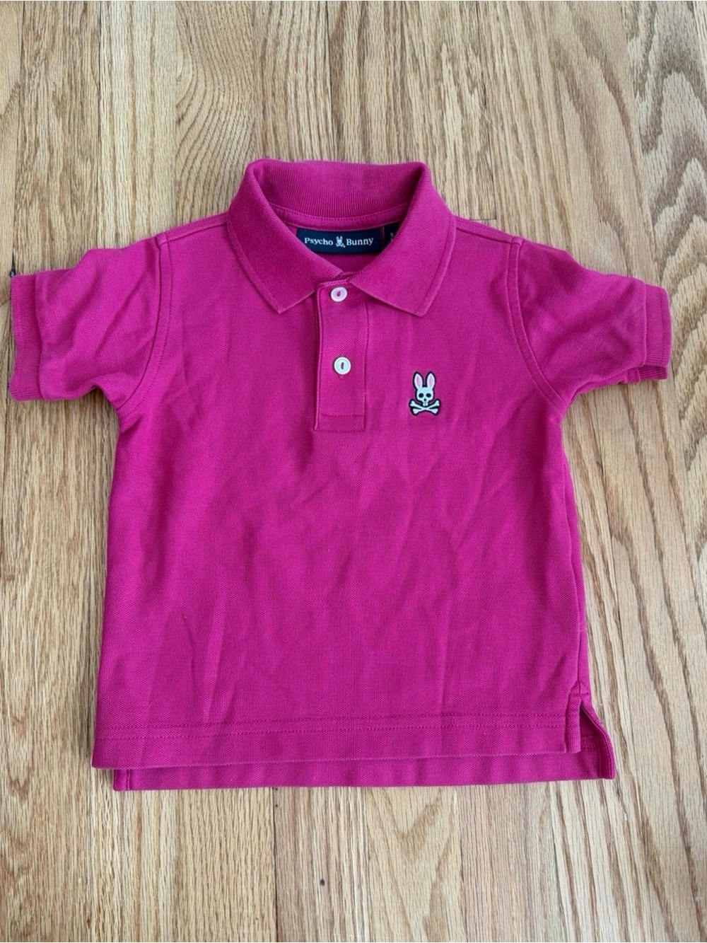 Psycho Bunny kids polo in bright fuchsia